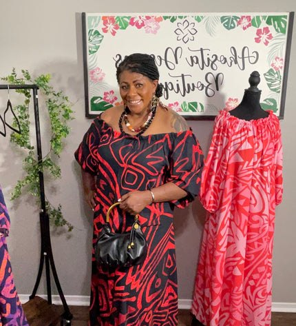 Red and Black Tribal Print Chiffon Maxi Dress with Statement Earrings and Hibiscus Hair Flower