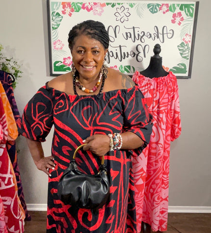Red and Black Tribal Print Chiffon Maxi Dress with Statement Earrings and Hibiscus Hair Flower