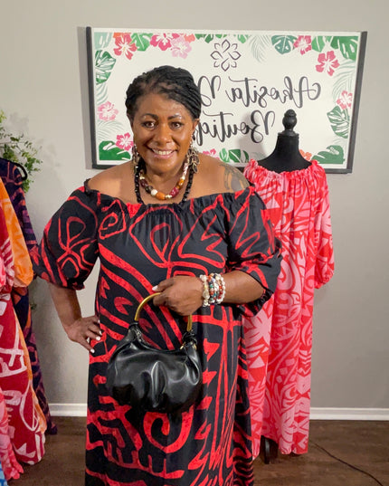 Red and Black Tribal Print Chiffon Maxi Dress with Statement Earrings and Hibiscus Hair Flower