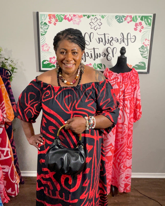 Red and Black Tribal Print Chiffon Maxi Dress with Statement Earrings and Hibiscus Hair Flower